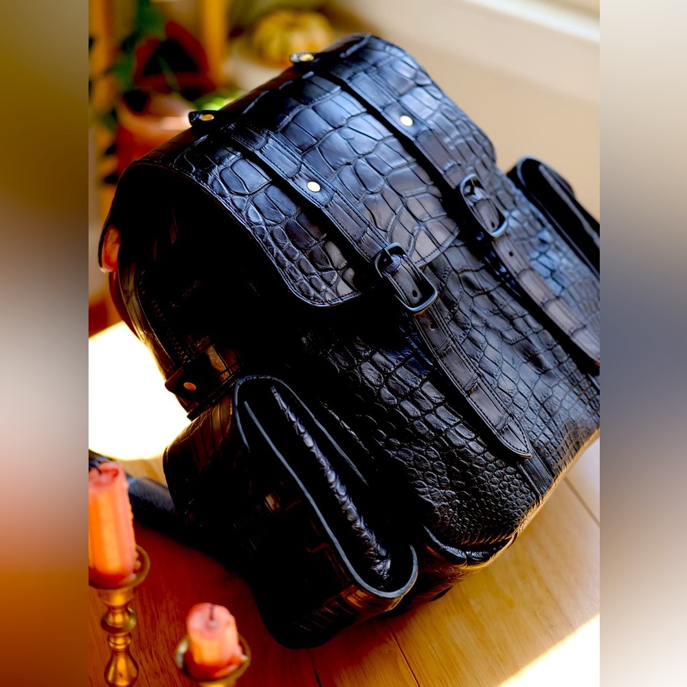 Designer one of one genuine alligator leather backpack matte with red accent.